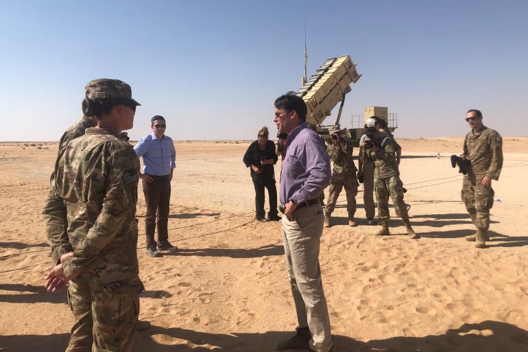 U.S. Defense Secretary Mark Esper speaks with U.S. troops in front of a Patriot missile battery at Prince Sultan Air Base