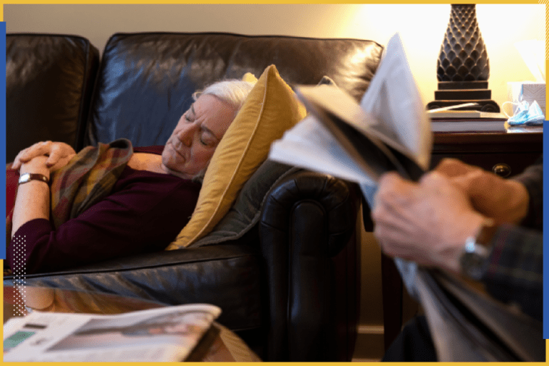 Penny Parkin, 69, who was exposed to COVID-19 on March 23, 2020, takes her daily afternoon nap while her husband, John Parkin, 85, reads the newspaper, in Doylestown, Pennsylvania, U.S., March 17, 2021. When I tell my husband that I’m really tired he says to stop what you’re doing and just lie down.” said Parkin as she continues to suffer from long term effects of the coronavirus disease. REUTERS/Hannah Beier TPX IMAGES OF THE DAY