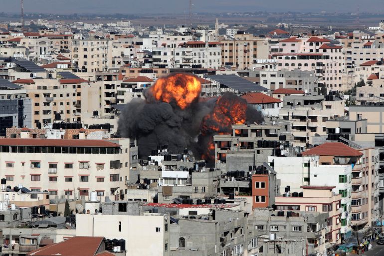 Smoke and flames rise during an Israeli air strike, amid a flare-up of Israeli-Palestinian violence, in Gaza City May 14, 2021. REUTERS/Mohammed Salem