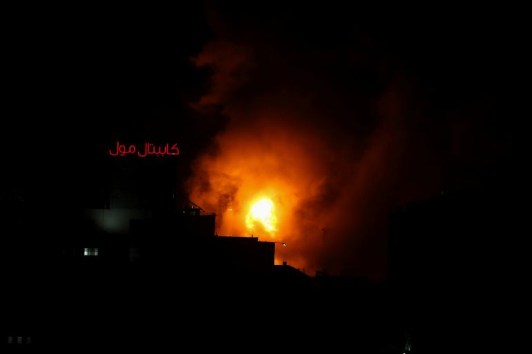 Smoke and flames rise during an Israeli air strike amid a flare-up of Israeli-Palestinian violence, in Gaza City May 12, 2021. REUTERS/Ibraheem Abu Mustafa