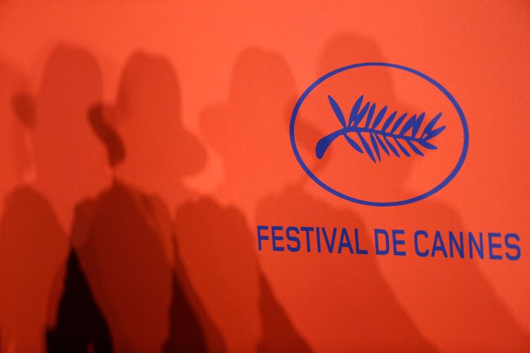 72nd Cannes Film Festival - News conference for the film "It Must Be Heaven" in competition 72nd Cannes Film Festival - News conference for the film "It Must Be Heaven" in competition - Cannes, France, May 25, 2019. Director Elia Suleiman casts his shadow on a wall with the official logo of the Cannes Film Festival during the news conference REUTERS/Stephane Mahe