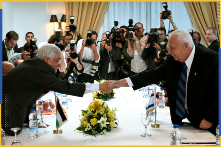 Palestinian President Mahmoud Abbas (L) and Israeli Prime Minister Ariel Sharon (R) shake hands during their meeting at Sharm el-Sheikh, February 8, 2005. Israeli and Palestinian leaders are expected to announce a cease-fire to halt more than four years of bloodshed and take a new step toward ending decades of conflict at a landmark summit on Tuesday. Pictures of the month February 2005 REUTERS/Aladin Abdel Naby OP/JV