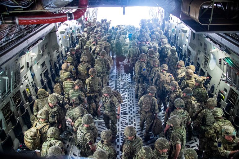 A member of British Forces from 16 Air Assault Brigade looks on upon arrival in Kabul, Afghanistan, to provide support to British nationals leaving the country