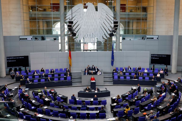 German Chancellor Merkel delivers a speech on the situation in Afghanistan at the lower house of parliament Bundestag in Berlin