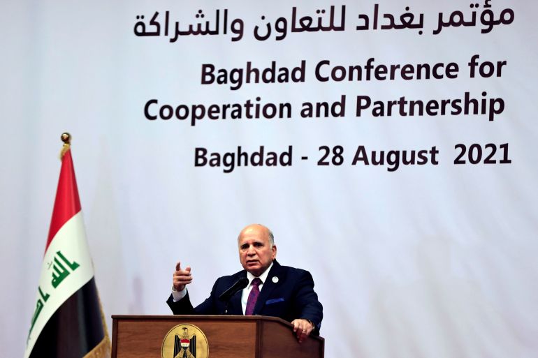 Iraqi Foreign Minister Hussein speaks to the media after the end of the summit in Baghdad