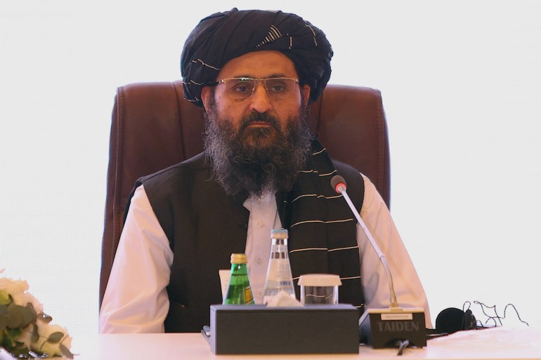 (FILES) In this file photo taken on July 18, 2021 The leader of the Taliban negotiating team Mullah Abdul Ghani Baradar looks on the final declaration of the peace talks between the Afghan government and the Taliban is presented in Qatar's capital Doha. - The Taliban's deputy leader and co-founder Mullah Abdul Ghani Baradar arrived in Kandahar on August 17, 2021, landing in the insurgent group’s former capital just days after they took control of the country. (Photo by KARIM JAAFAR / AFP)