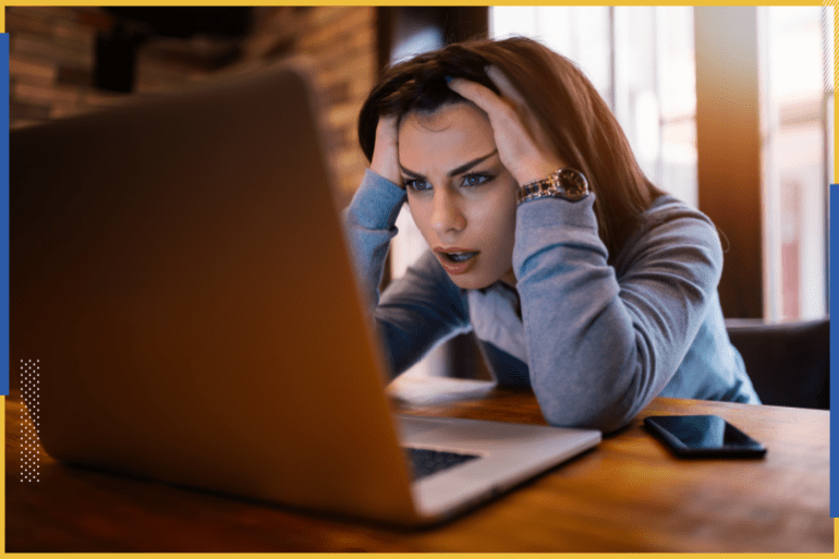Frustrated worried young woman looking at laptop upset by bad news, teenager feels shocked afraid of reading negative bullying message, stressed girl troubled with problem online or email notification.