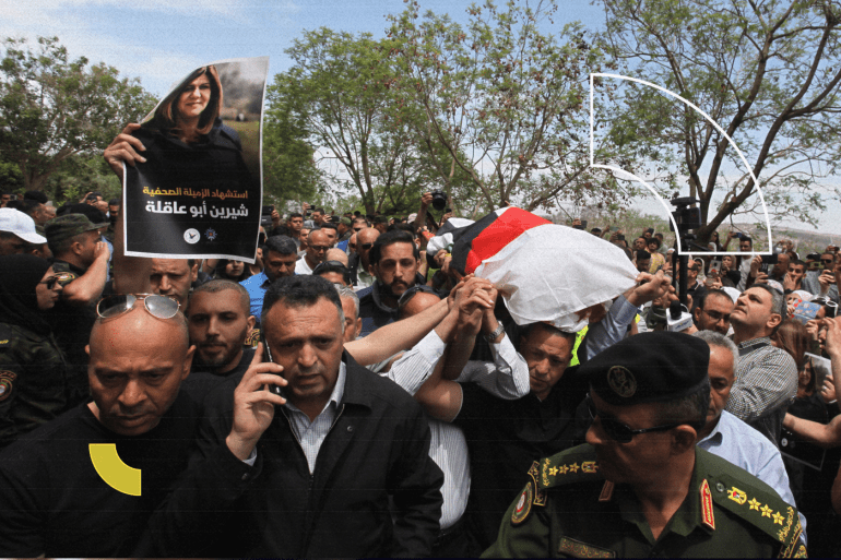 The dead body of Shireen Abu Akleh killed by Israeli soldiers brought to Nablus for autopsy- - NABLUS, WEST BANK - MAY 11: Press members carry female reporter of Al-Jazeera television channel Shirin Abu Akleh's dead body for autopsy at Al- Najah Hospital in Nablus, West Bank on May 11, 2022. Akleh lost her life as a result of fire opened by Israeli soldiers in the Jenin refugee camp.