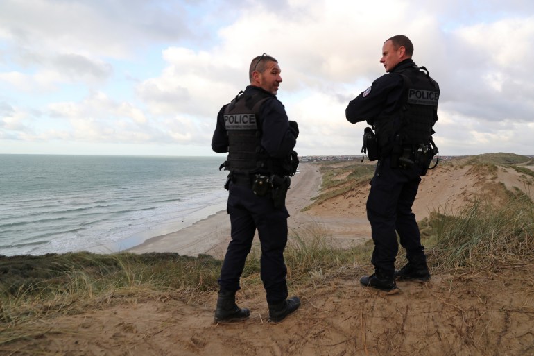 French police patrol the beach in Wimereux after migrant tragedy