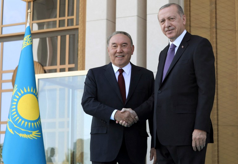 Turkish President Recep Tayyip Erdogan (R) welcomes President of Kazakhstan Nursultan Nazarbayev (L) during an official ceremony at the Presidential Complex in Ankara, on September 13, 2018. (Photo by ADEM ALTAN / AFP)