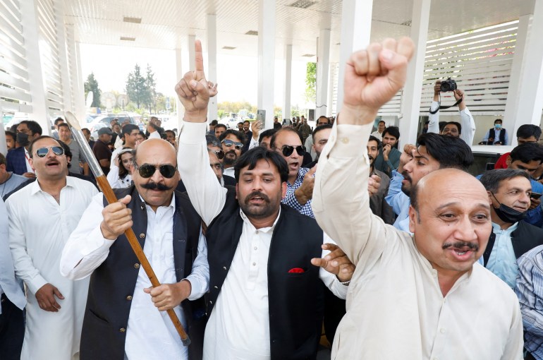 Supporters of the united opposition chant slogans outside parliament building Islamabad,
