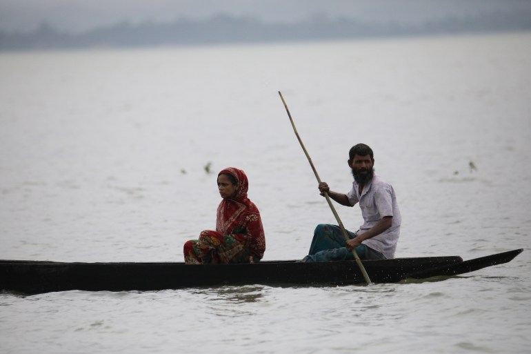 SYLHET, BANGLADESH - JUNE 19: People are seen on a boat after flash floods at Goainghat sub-distric in Sylhet, Bangladesh on June 19, 2022. The flooding killed at least 18 people and flooded millions of homes in northeastern India and Bangladesh. ( Zakir Hossain Chowdhury - Anadolu Agency )