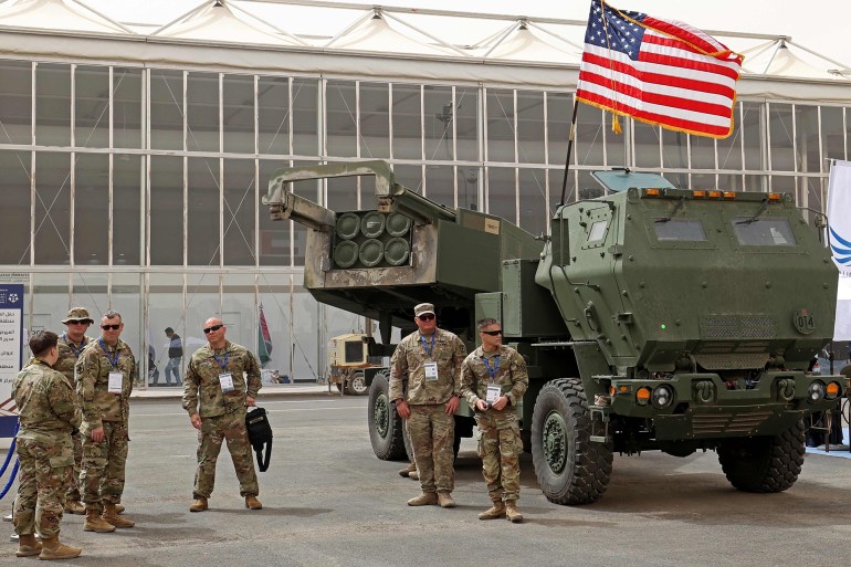 FILES) In this file photo taken on March 06, 2022 US military personnel stand by a M142 High Mobility Artillery Rocket System (HIMARS) during Saudi Arabia’s first World Defense Show, north of the capital Riyadh. The United States will send Ukraine four Himars artillery rocket systems, an additional 1,000 Javelin anti-tank missiles, and four Mi-17 helicopters in a new $700 million arms package, the Pentagon said June 1, 2022. Fayez Nureldine / AFP