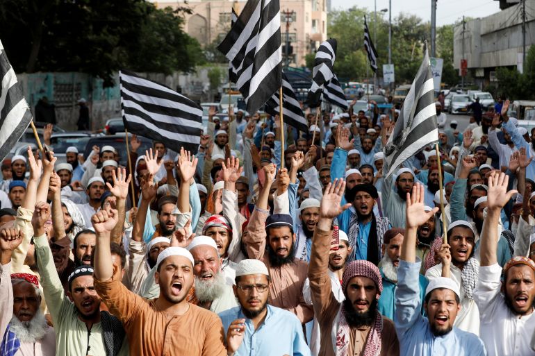 Supporters of the Jamiat Ulema-e-Islam-Fazal (JUI-F) religious and political party chant slogans during a protest in Karachi