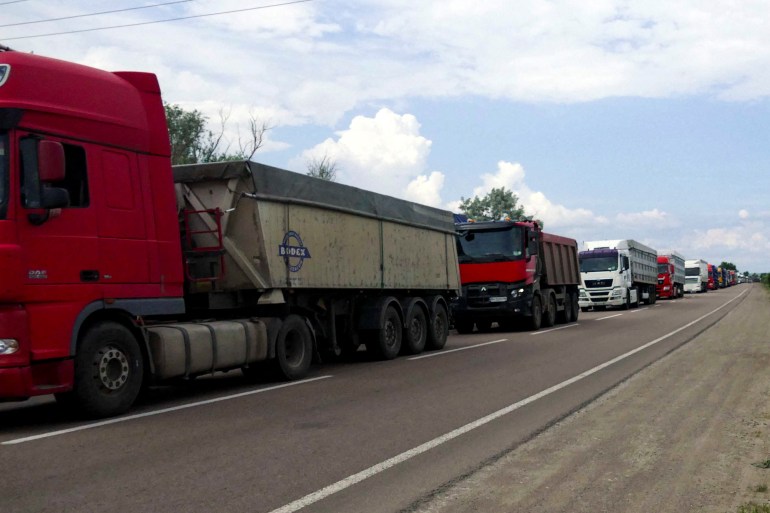 Trucks with grain wait for crossing the Ukraine-Moldova border in Odesa region