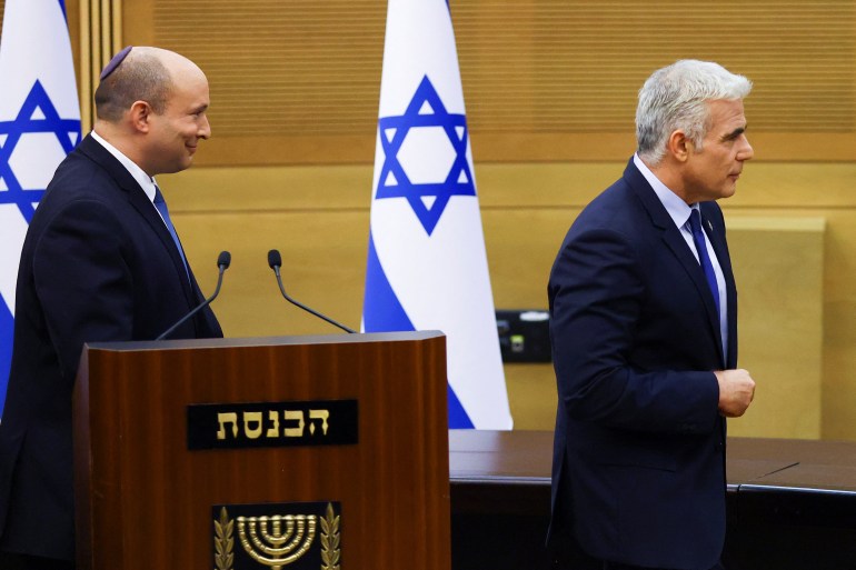 Israeli Prime Minister Naftali Bennett and Foreign Minister Yair Lapid give a statement, in Jerusalem