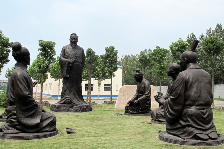 Sculptures of Confucius with his students are seen near the headquarters office building of Chambroad Holding in Boxing