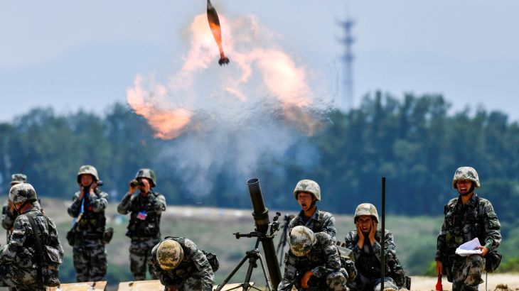 PLA soldiers fire a mortar during a live-fire military exercise in Anhui