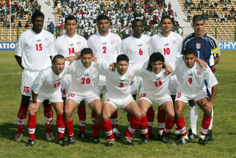 The Tunisian national soccer team poses 25 January 2002 in Bamako before the start of the XXIIIrd African Cup of Nations Mali 2002 match between Tunisia and Egypt. Tunisia is qualified for the 2002 FIFA World Cup Korea/Japan scheduled from 31 May to 30 June. (Standing from left: Radhi Jaidi, Hamdi Marzouki, Khaled Badra, Hatem Trabelsi, Kais Godhbane and Chokri El Ouaer; bottom from left: Raouf Bouzaene, Mourad Malki, Zoubeir Baya, Riadh Bouazizi and Jamel Zabi.) AFP PHOTO FRANCK FIFE (Photo by Franck FIFE / AFP) (Photo credit should read FRANCK FIFE/AFP via Getty Images)