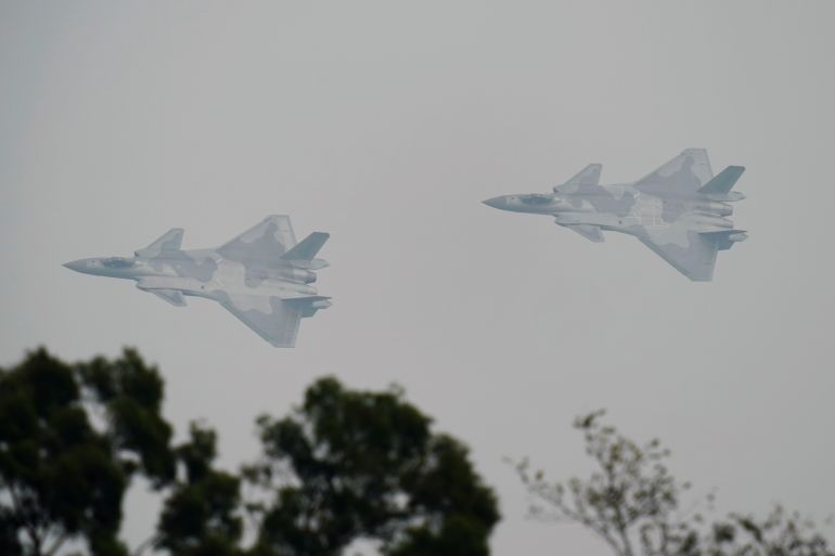 J-20 stealth fighters of Chinese People's Liberation Army Air Force (PLAAF) are seen during a test flight ahead of Zhuhai Airshow