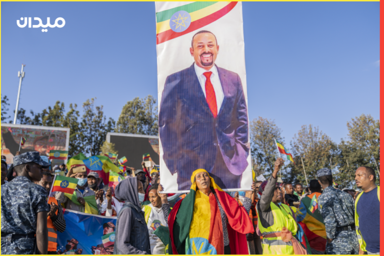 epa09569390 Ethiopians carry a poster of president Abiy Ahmed as they attend a rally held to show support for the government and the Ethiopian National Defense Force (ENDF), in their effots against the Tigray Peoples Liberation Front (TPLF) and Oromo Liberation Army (OLA), in Addis Ababa, Ethiopia, 07 November 2021. According to a report released 03 November 2021 by the UN high commission for Human Rights, war crimes and other crimes against humanity have been conducted by both sides in the year long bloody civil war. A nationwide state of emergency has been declared in Ethiopia following advances south through the Amhara region towards the capital city Addis Ababa by the TPLF. EPA-EFE/STR