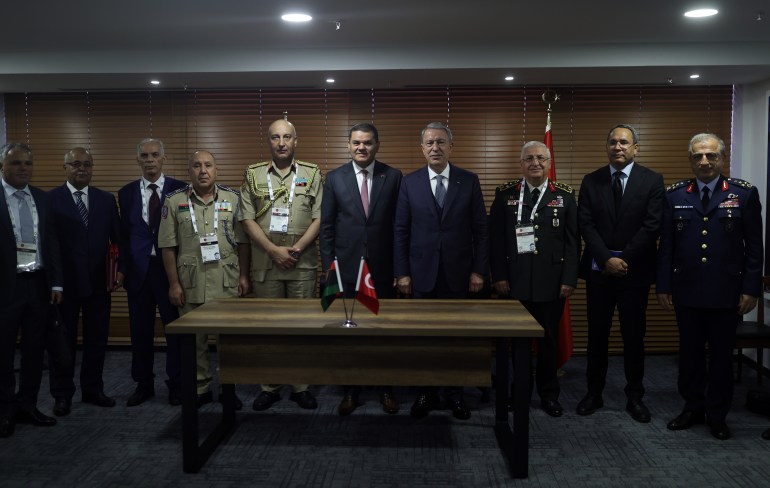 ISTANBUL, TURKIYE - OCTOBER 25: Turkish Minister of National Defense Hulusi Akar (4th R) and Libya's Prime Minister of National Unity Government Abdul Hamid Dbeibeh (5th R) pose for a photo after signing agreement between two countries in Istanbul, Turkiye on October 25, 2022. Turkish Armed Forces to contribute to the training of Libyan military pilots. ( Arif Akdoğan - Anadolu Agency )