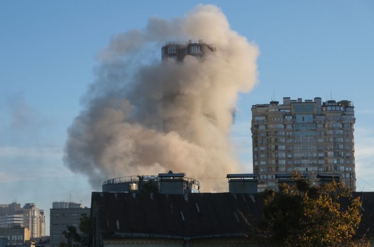 Smoke billows from a building hit by a drone in downtown Kyiv. [Vadym Sarakhan/EPA