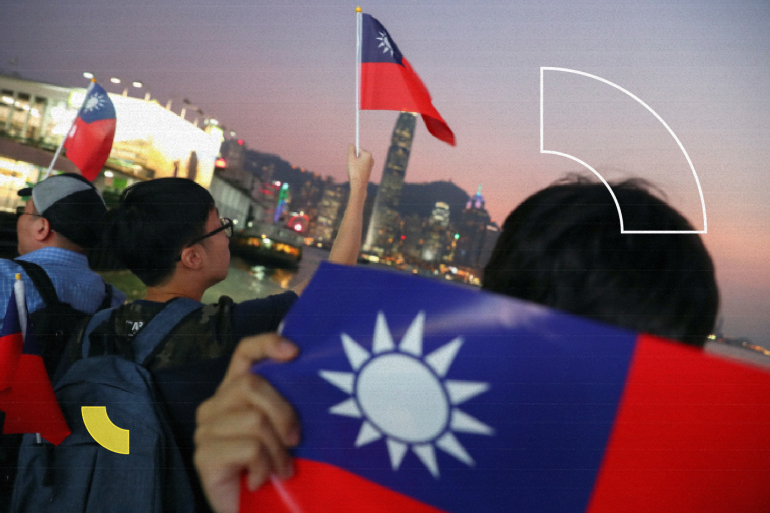 Anti-government protesters hold Taiwan national flags during a protest to celebrate Taiwan's National Day at the Harbour city in Tsim Sha Tsui district, in Hong Kong, China October 10, 2019. REUTERS/Athit Perawongmetha