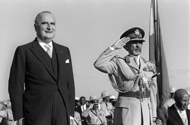 French President Georges Pompidou (1911-1974) and Emperor of Ethiopia Haile Selassie (1892-1975) listen 17 January 1973 to the national anthems upon Pompidou's arrival in Addis Ababa for a 3-day state visit to Ethiopia, the last stage of his trip to the Horn of Africa. Pompidou arrived from Djibouti, the French territory of Afars and Issas. AFP PHOTO (Photo by AFP)