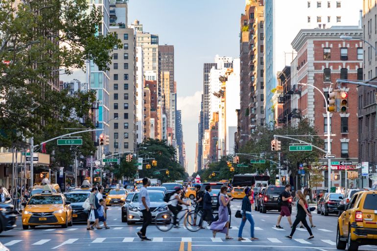 NEW YORK CITY - CIRCA 2017: Busy crowds of people walk across 3rd Avenue in front of rush hour traffic in the East Village neighborhood of Manhattan in New York City.; Shutterstock ID 788608396; purchase_order: ajnet; job: ; client: ; other: