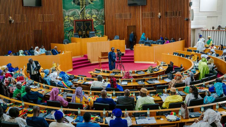 Senegalese deputies take part in the first parliamentary session since the July 2022 legislative elections, in Dakar on September 12, 2022. (Photo by CARMEN ABD ALI / AFP)