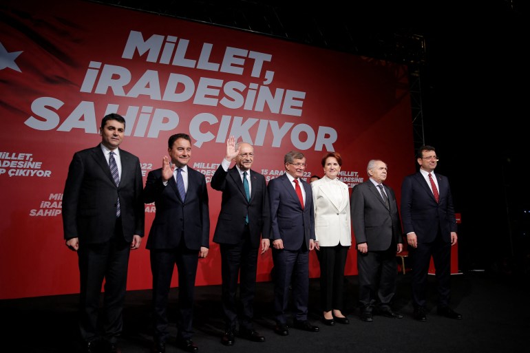 Leaders of the six-party opposition alliance pose with Istanbul Mayor Imamoglu
