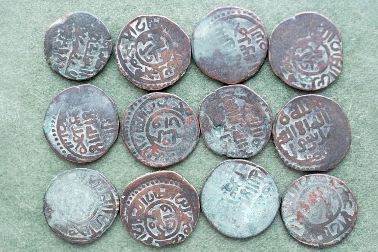 ancient islamic coin collection background shutterstock_73199350