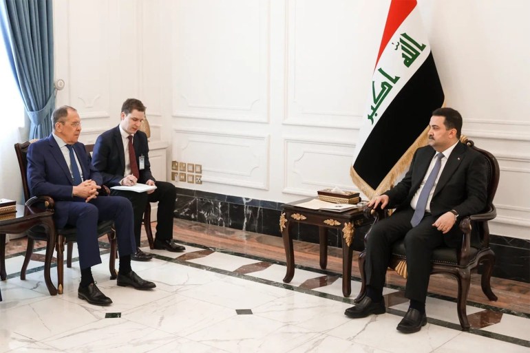Russian Foreign Minister Sergei Lavrov (L) meets with Iraq's Prime Minister Mohammed Shia' al-Sudani in Baghdad on February 6, 2023. Handout / RUSSIAN FOREIGN MINISTRY / AFP