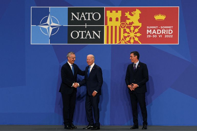 U.S. President Joe Biden is greeted by NATO Secretary General Jens Stoltenberg and Spain's Prime Minister Pedro Sanchez at the NATO summit in Madrid, Spain June 29, 2022. Kenny Holston/Pool via REUTERS