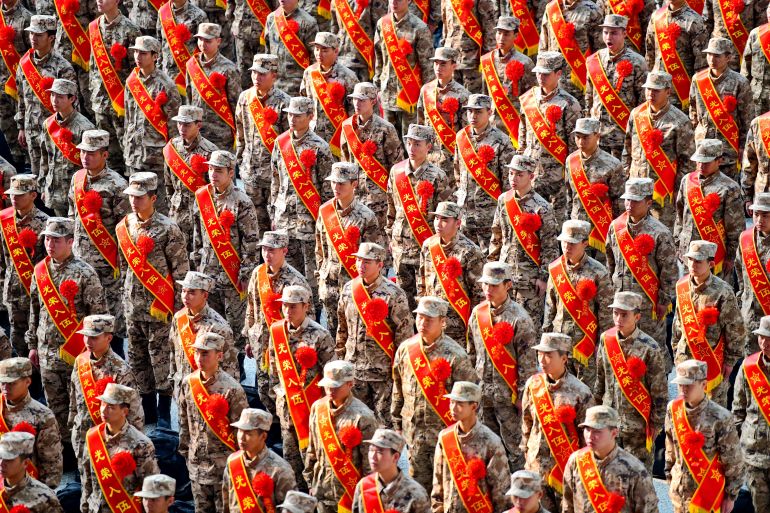 New recruits of Chinese People's Liberation Army (PLA) attend a send-off ceremony at a railway station in Ganzhou, Jiangxi province, China March 16, 2023. China Daily via REUTERS ATTENTION EDITORS - THIS PICTURE WAS PROVIDED BY A THIRD PARTY. CHINA OUT. NO COMMERCIAL OR EDITORIAL SALES IN CHINA.