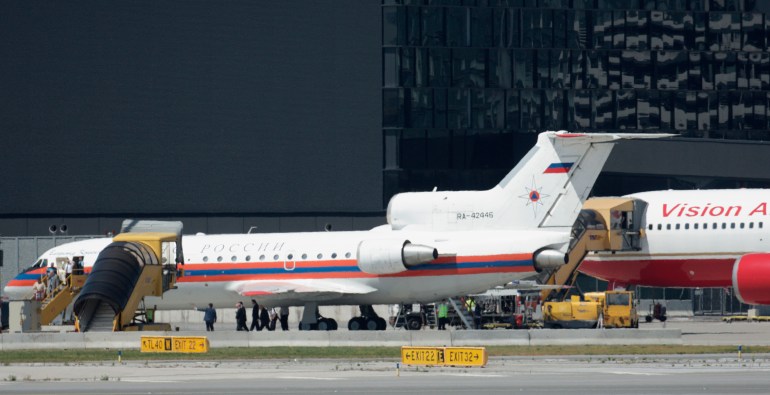 An aircraft of the United States and a Russian aircraft stand on the tarmac during spy exchange at Vienna airport