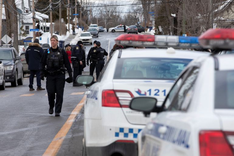 Laval police vehicles mark a road block along Dufferin Terrace where in the morning a Laval city bus crashed into the Garderie Educative Sainte-Rose, in Laval