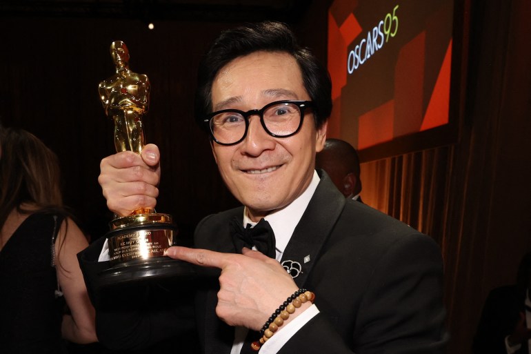 Best Supporting Actor Ke Huy Quan reacts after having his Oscar engraved at the Governors Ball following the Oscars show at the 95th Academy Awards in Hollywood, Los Angeles, California, U.S., March 12, 2023. REUTERS/Mario Anzuoni