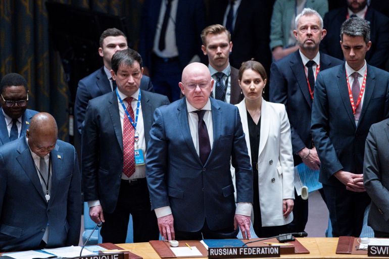 Representatives of the Russian Federation observe a minute of silence during a meeting at the United Nations Security Council, to mark one year since Russia invaded Ukraine, at U.N. headquarters in New York City, New York, U.S., February 24, 2023. REUTERS/Eduardo Munoz
