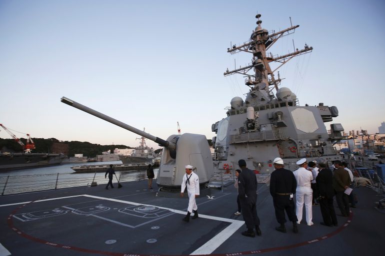 Military personnel are seen on the deck of the U.S. guided-missile destroyer USS Milius (DDG69) at the U.S. naval base in Yokosuka