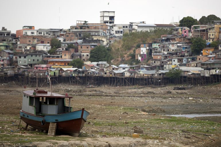 A boat lies on the bottom of a branch of the Rio Negro, a tributary to the Amazon river, in the city of Manaus, Brazil