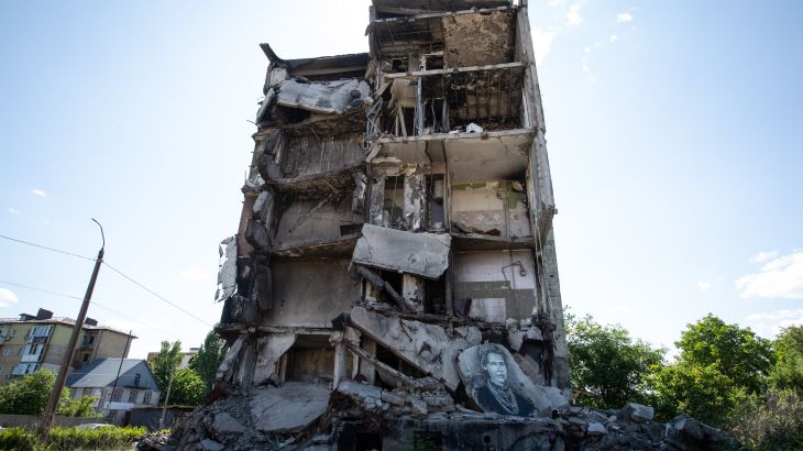 Graffitis of Lesya Ukrainka on a destroyed building in Ukraine