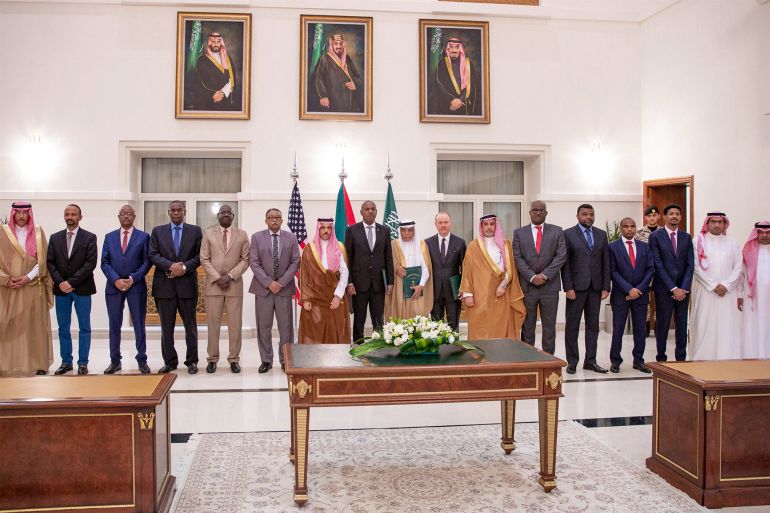 MAY 21, 2023 - 11:08 AM saudi  -  sudan  -  conflict Jeddah, Saudi Arabia STRSPAAFP A handout picture provided by the Saudi Press Agency (SPA) on May 21, 2023, shows Saudi Foreign Minister Faisal bin Farhan (C), flanked by representatives of the Sudanese army and the rival Paramilitary Rapid Support forces, posing for a photograph after the signing of a ceasefire agreement in Jeddah. With heavy fighting raging in Khartoum, the rival sides struck a deal on a seven-day ceasefire beginning the evening of May 22, the United States and Saudi Arabia said on May 21 in a joint statement after talks in Jeddah. (Photo by SPA / AFP) / === RESTRICTED TO EDITORIAL USE - MANDATORY CREDIT "AFP PHOTO / HO / SPA" - NO MARKETING NO ADVERTISING CAMPAIGNS - DISTRIBUTED AS A SERVICE TO CLIENTS === - === RESTRICTED TO EDITORIAL USE - MANDATORY CREDIT "AFP PHOTO / HO / SPA" - NO MARKETING NO ADVERTISING CAMPAIGNS - DISTRIBUTED AS A SERVICE TO CLIENTS ===