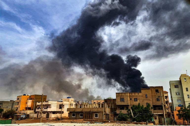 Smoke plumes billow from a fire at a lumber warehouse in southern Khartoum amidst ongoing fighting on June 7, 2023. - Eight weeks of fighting have pitted Sudan's army chief Abdel Fattah al-Burhan against his former deputy Mohamed Hamdan Daglo -- commonly known as Hemeti -- who commands the powerful paramilitary Rapid Support Forces (RSF). A number of broken ceasefires have offered brief lulls but no respite for residents of Khartoum, where witnesses again reported "the sound of heavy artillery fire" in the capital's northwest. (Photo by - / AFP)