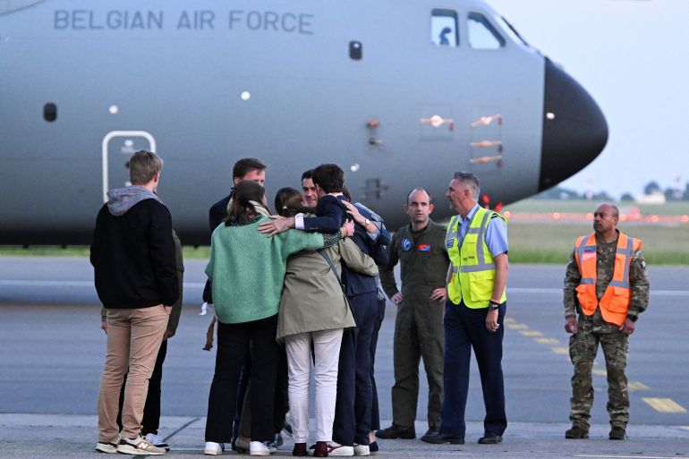 Belgian Aid worker Olivier Vandecasteele, 42, who was arrested on a visit to Iran in February 2022 and sentenced to 40 years in prison and 74 lashes on charges including spying, is welcomed by his family at Belgium’s Melsbroek military airport after being freed in a swap with an Iranian diplomat imprisoned in Belgium in connection with a failed bomb plot, in Steenokkerzeel, Belgium May 26, 2023. Didier Lebrun/Pool via REUTERS