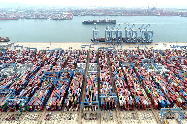FILE PHOTO: Containers and cargo vessels at the Qingdao port