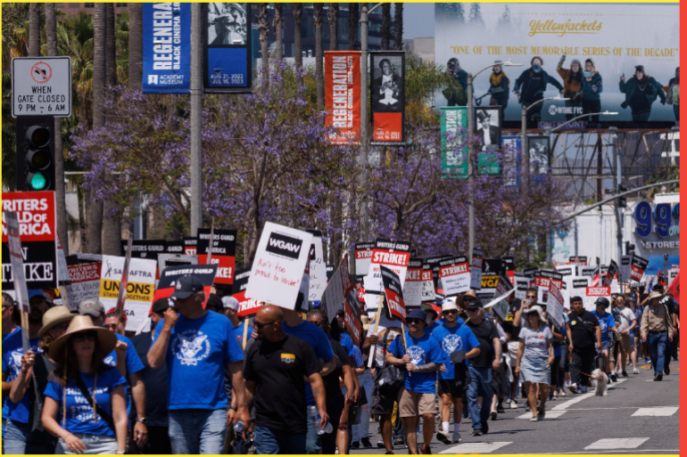 The Writers Guild of America holds a march and rally as the film and TV writers strike continues in Los Angeles, California, U.S., June 21, 2023. REUTERS/Mike Blake