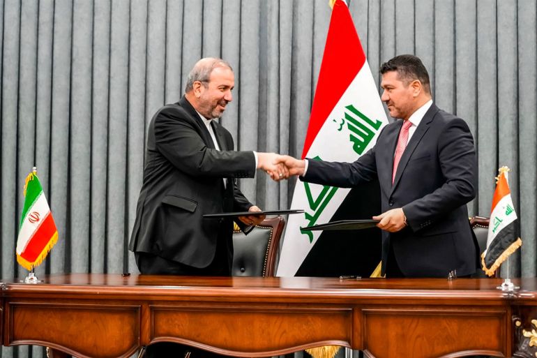 JULY 11, 2023 - 10:00 AM iraq  -  iran  -  politics  -  diplomacy  -  energy  -  natural gas Baghdad, Iraq -IRAQI PRIME MINISTER'S PRESS OFFICEAFP A handout picture released by Iraq's Prime Minister's Media Office shows the PM chief of staff Ihsan al-Awadi (R) and Iran's ambassador to Baghdad Mohammad Kazem al-Sadeq shaking hands as they exchange signed bilateral agreements during a ceremony in Baghdad on July 11, 2023. Iraq will start paying for its Iranian gas imports with oil, to circumvent the complicated mechanism agreed with Washington in order not to contravene US sanctions, the prime minister said on July 11. Iranian gas is crucial for Iraq's electricity generation, but US sanctions on Iranian oil and gas impose restrictions on how Baghdad can pay for the imports. Iraq cannot directly hand over cash to Iran, but payments must be held in a bank account and be used by Tehran to fund imports of food and medicines. (Photo by IRAQI PRIME MINISTER'S PRESS OFFICE / AFP) / === RESTRICTED TO EDITORIAL USE - MANDATORY CREDIT "AFP PHOTO / HO / IRAQI PRIME MINISTER'S PRESS OFFICE" - NO MARKETING NO ADVERTISING CAMPAIGNS - DISTRIBUTED AS A SERVICE TO CLIENTS === - === RESTRICTED TO EDITORIAL USE - MANDATORY CREDIT "AFP PHOTO / HO / IRAQI PRIME MINISTER'S PRESS OFFICE" - NO MARKETING NO ADVERTISING CAMPAIGNS - DISTRIBUTED AS A SERVICE TO CLIENTS ===
