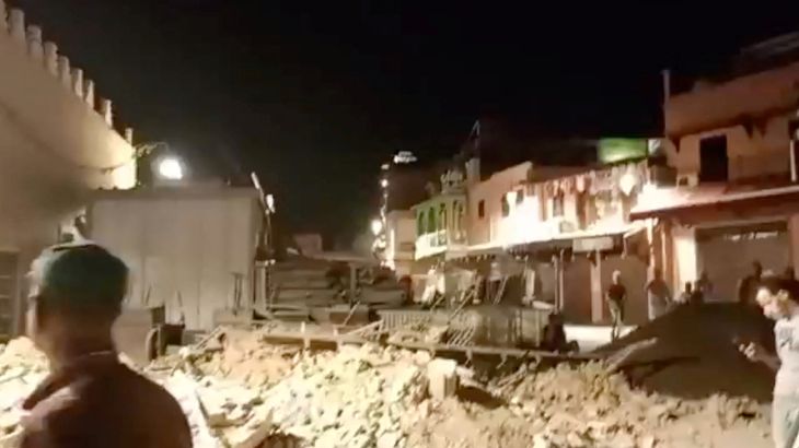 People look at debris in the aftermath of an earthquake in Marrakech, Morocco September 9, 2023 in this screen grab from a social media video in this picture. Al Maghribi Al Youm/via REUTERS THIS IMAGE HAS BEEN SUPPLIED BY A THIRD PARTY. MANDATORY CREDIT. NO RESALES. NO ARCHIVES.